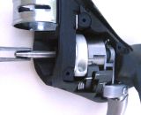 Remove the axle with needle nose pliers